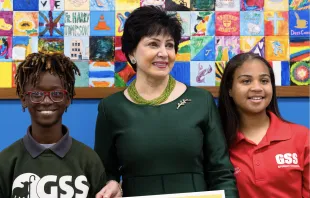New Orleans Saints and Pelicans owner Gayle Benson pictured with two students at Good Shepherd School in New Orleans, where she announced her decision to give a large donation to fund the opening of a second school in December 2023. Courtesy: New Orleans Saints
