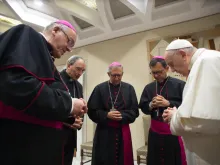 Pope Francis prays with French bishops before his general audience, Oct. 6, 2021, in the wake of a devastating abuse report.