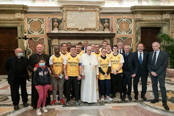 Pope Francis with members of the ‘Pope’s Team - Fratelli tutti’ in the Vatican’s Clementine Hall, Nov. 20, 2021.