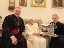 Bishop Rudolf Voderholzer, Pope emeritus Benedict XVI, and Archbishop Georg Gänswein with the nativity scene on Dec. 8, 2021.