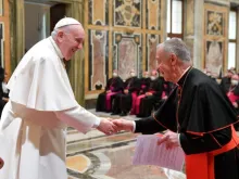 Pope Francis greets Cardinal Luis Ladaria.