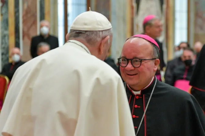 Pope Francis greets Archbishop Charles Scicluna at the Vatican’s Clementine Hall, Jan. 21, 2022.