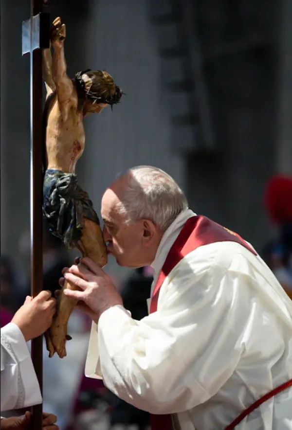 Pope Francis venerates the cross at the Good Friday liturgy in St. Peter’s Basilica, April 15, 2022. Vatican Media.