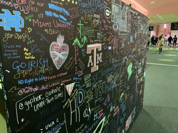 A board with signatures from students across the country is on display at the SEEK conference in St. Louis on Jan. 5, 2024. Credit: Jonah McKeown/CNA