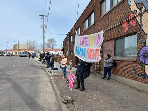 Pro-life advocates hold signs up outside the Planned Parenthood clinic where VP Kamala Harris visited. Credit: Brian Gibson of Pro-Life Action Ministries