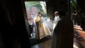 Bishop Robert J. Brennan of Brooklyn holds the Eucharist as he enters Our Lady of Lebanon Maronite Cathedral in Brooklyn, New York, on May 26, 2024. The visit was part of the New York leg of the National Eucharistic Pilgrimage.