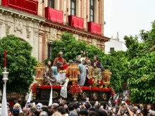 The Brotherhood of the Holy Supper processes through Seville, Spain, on Holy Monday, March 25, 2024.