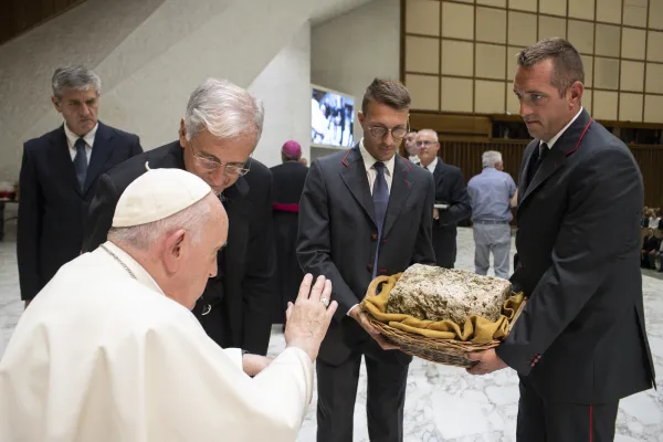 Pope Francis blesses a stone from the Abbey of Saint Eutizio in Umbria. The abbey, one of the oldest in Italy, is being repaired after it was damaged in a 2016 earthquake. Vatican Media.