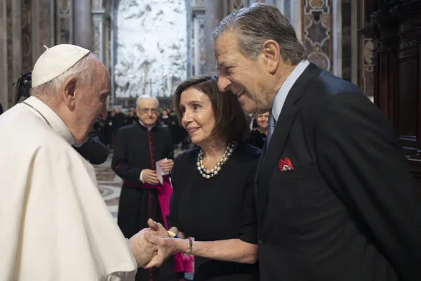 Pope Francis speaks to House Speaker Nancy Pelosi and Paul Pelosi after Mass in St. Peter's Basilica on June 29, 2022. Vatican Media