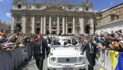 Pope Francis greets thousands of children and their families as he makes his way through St. Peter's Square during the first World Children's Day, Saturday, May 26, 2024.