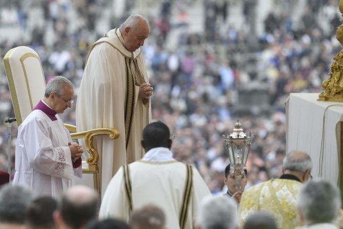 Pope Francis prays during Easter Sunday Mass in St. Peter's Square on March 31, 2024.