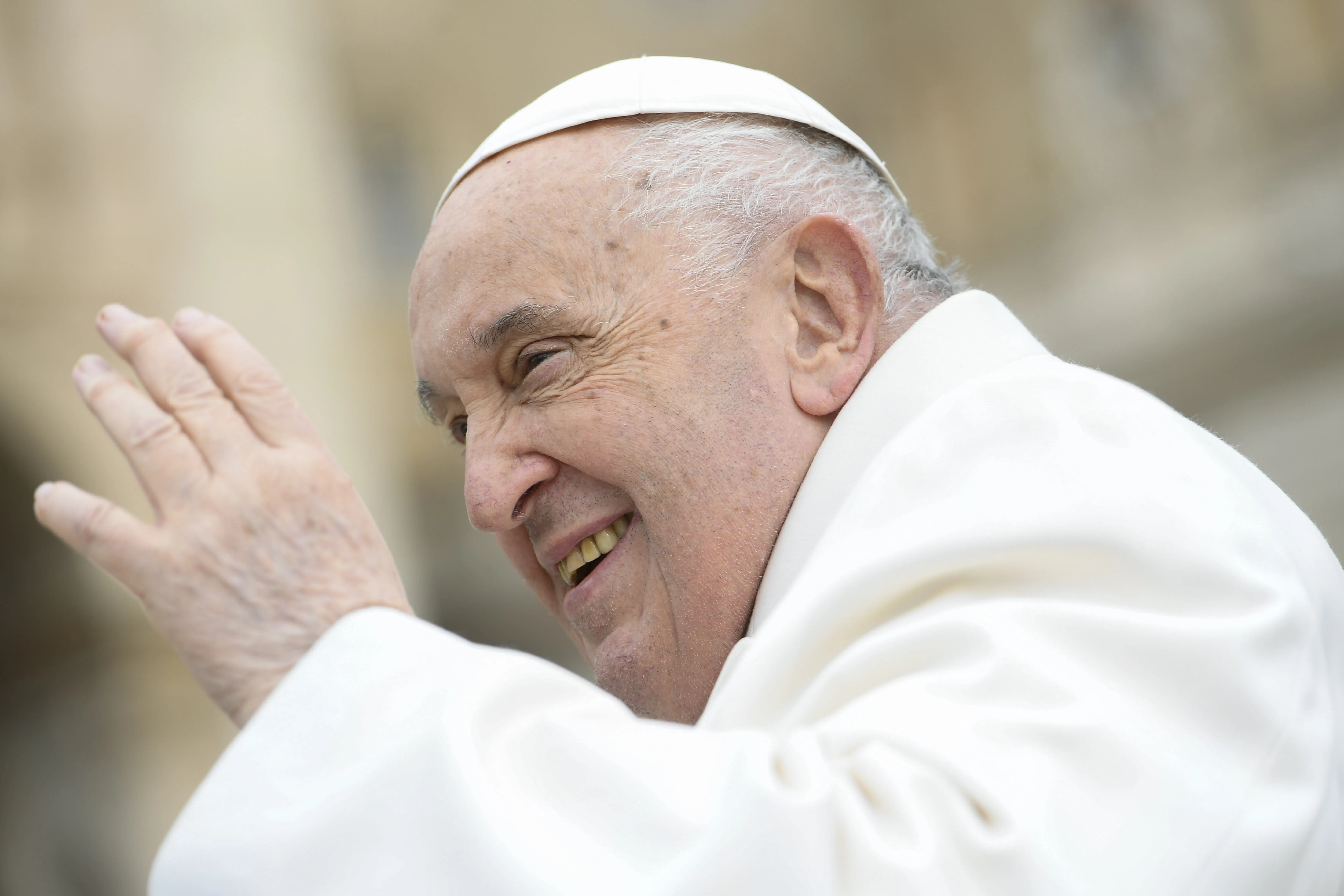 Pope Francis waves to pilgrims in St. Peter's Square gathered for his weekly general audience on April 3, 2024.?w=200&h=150