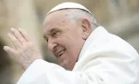 Pope Francis waves to pilgrims in St. Peter's Square gathered for his weekly general audience on April 3, 2024.