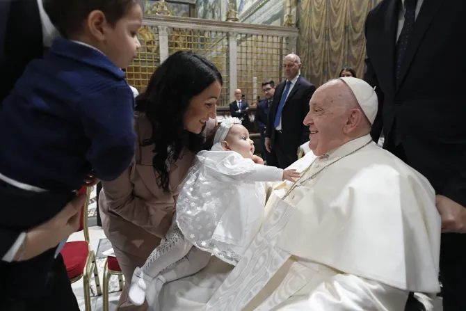 Pope Francis baptizes babies in the Sistine Chapel on January 7, 2024.