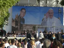 Pope Francis sits in front of an image of Blessed Giuseppe "Don Pino" Puglisi during a meeting with young people in the Archdiocese of Palermo, on the Italian island region Sicily, on Sept. 15, 2018.
