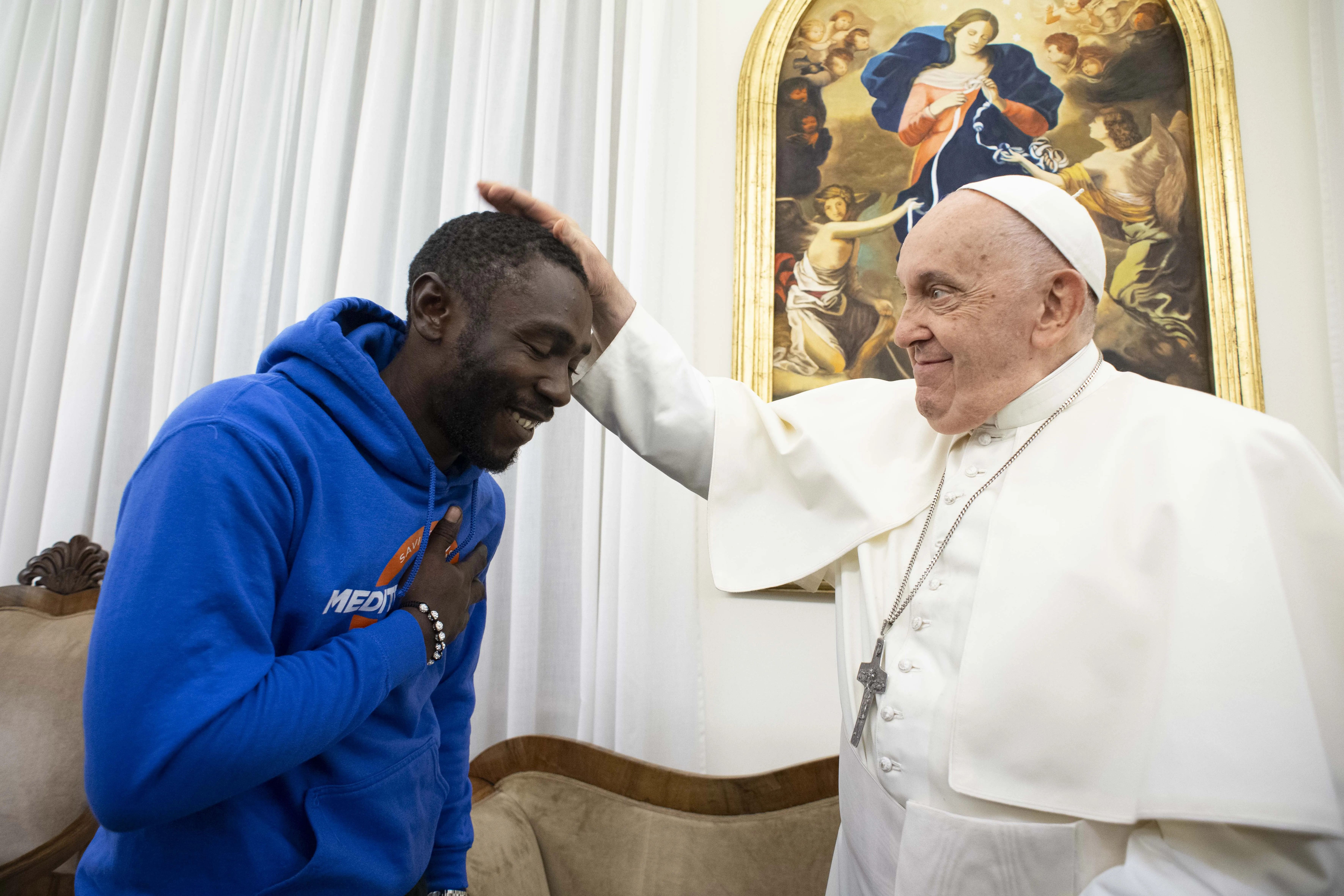 Pope Francis meets with 30-year-old Mbengue Nyimbilo Crepin, who shared his story during a meeting at the pope’s Vatican City residence Casa Santa Marta on Nov. 17, 2023.?w=200&h=150