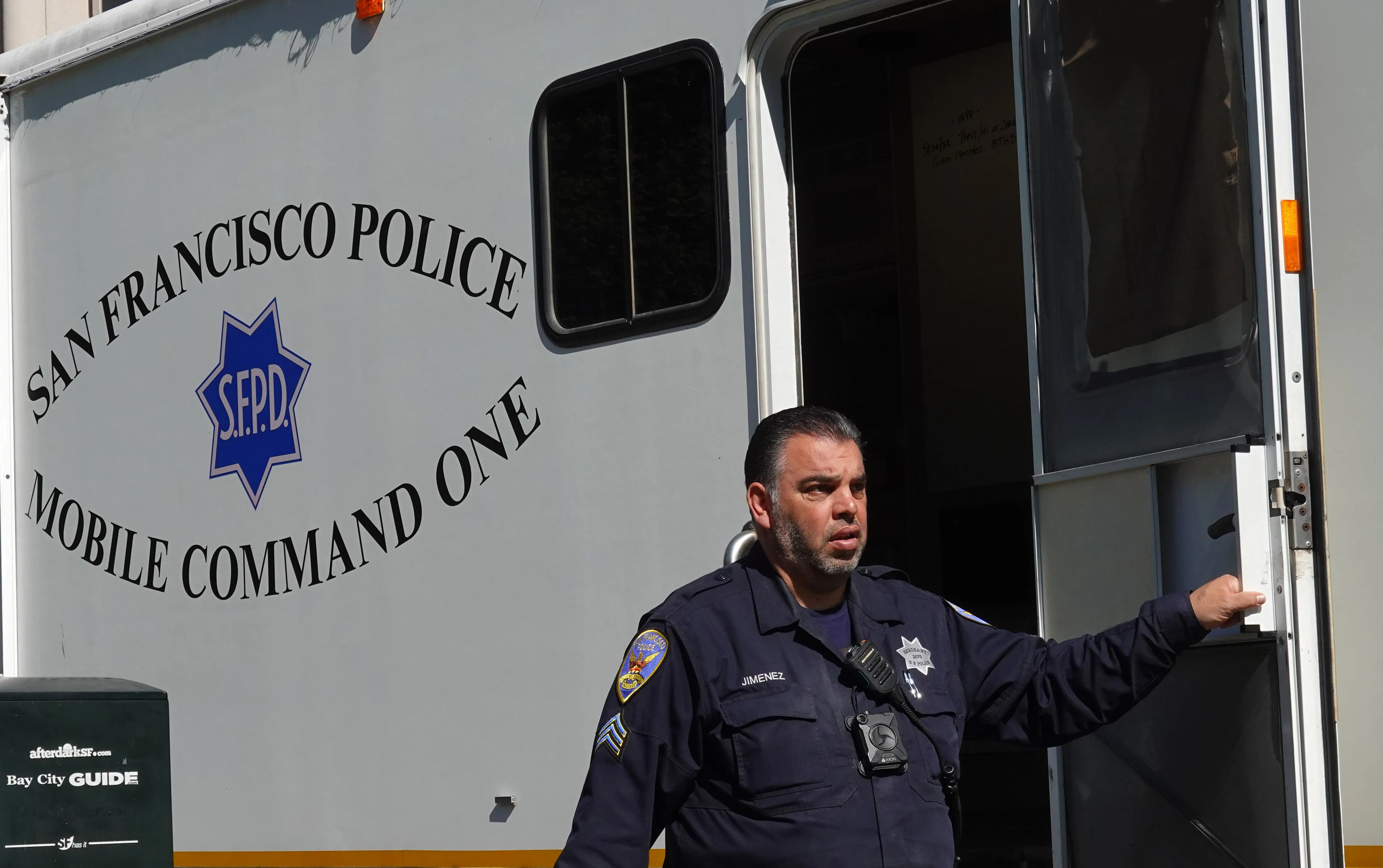 A San Francisco police officer steps out of the mobile command unit in San Francisco, California.?w=200&h=150