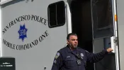 A San Francisco police officer steps out of the mobile command unit in San Francisco, California.