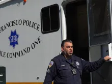 A San Francisco police officer steps out of the mobile command unit in San Francisco, California.