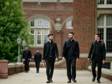 Seminarians chat as they walk along the promenade in front of Sacred Heart Major Seminary in Detroit. Starting in the fall semester of 2024, first-year seminarians at Sacred Heart and seminaries across the country will undertake a "propaedeutic" year focused on personal, spiritual, and relationship growth, limiting the use of technology while spending more time in prayer and communion with others.