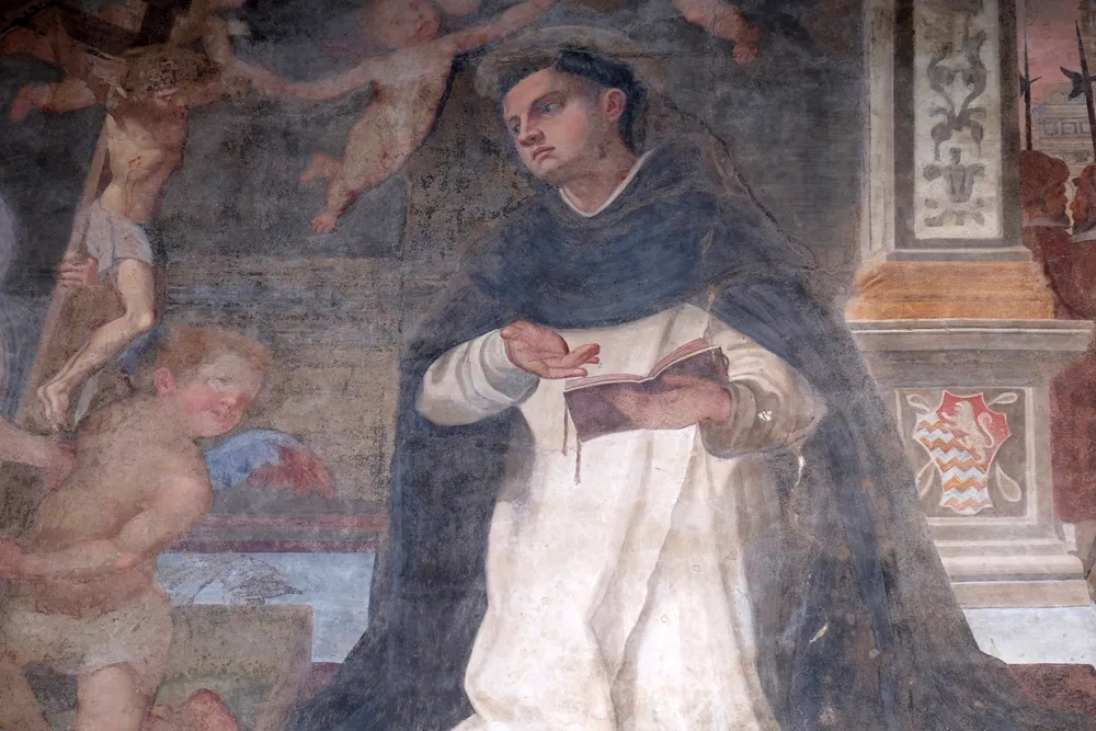 The lunette of a side door depicting St. Thomas Aquinas, detail of the facade of the Church of Santa Maria Novella in Florence, Italy.?w=200&h=150