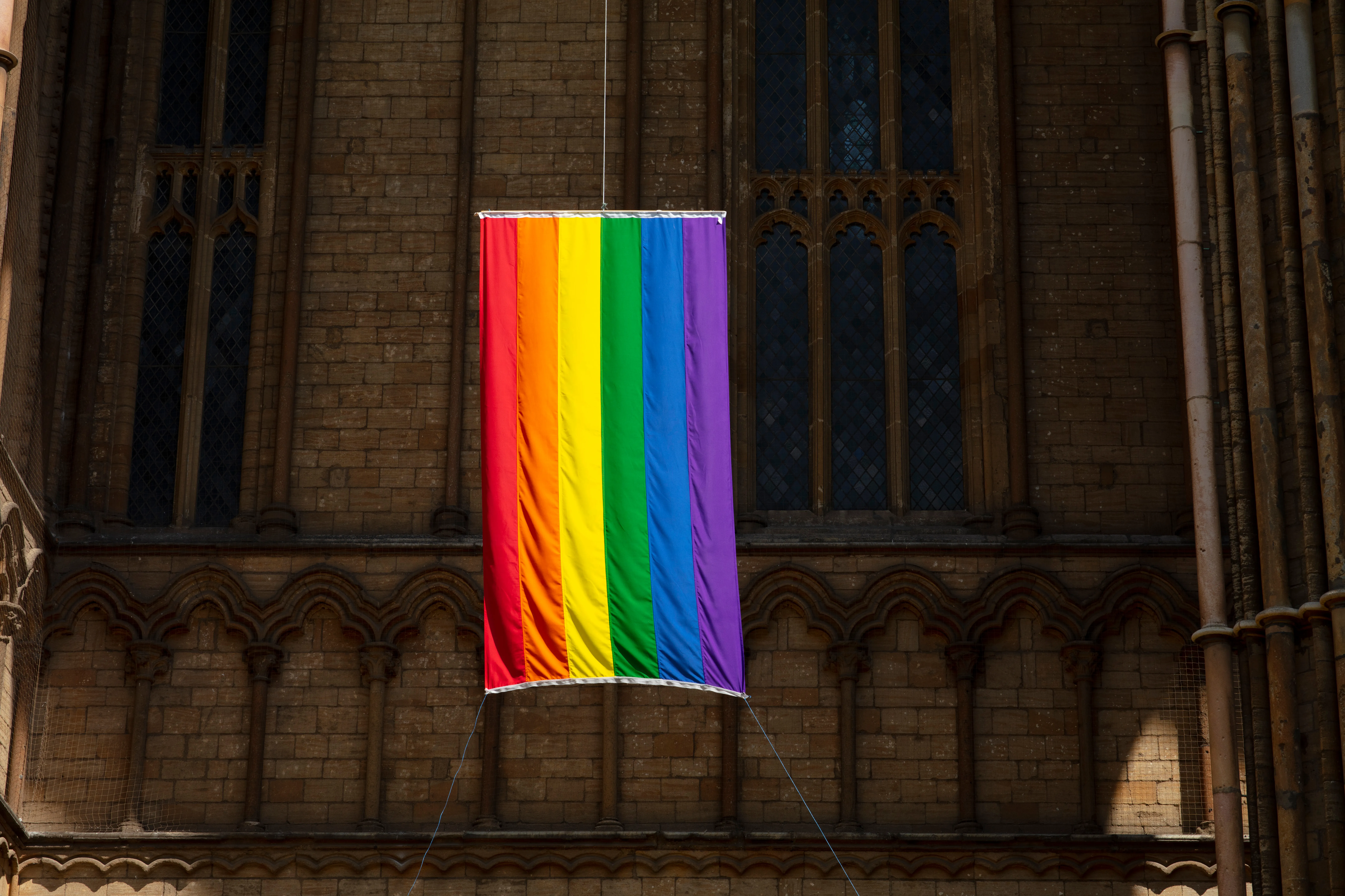 A pride flag hangs from the Peterborough Cathedral in England in 2019.?w=200&h=150