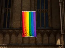 A view of a Pride flag hanging from Peterborough Cathedral in 2019