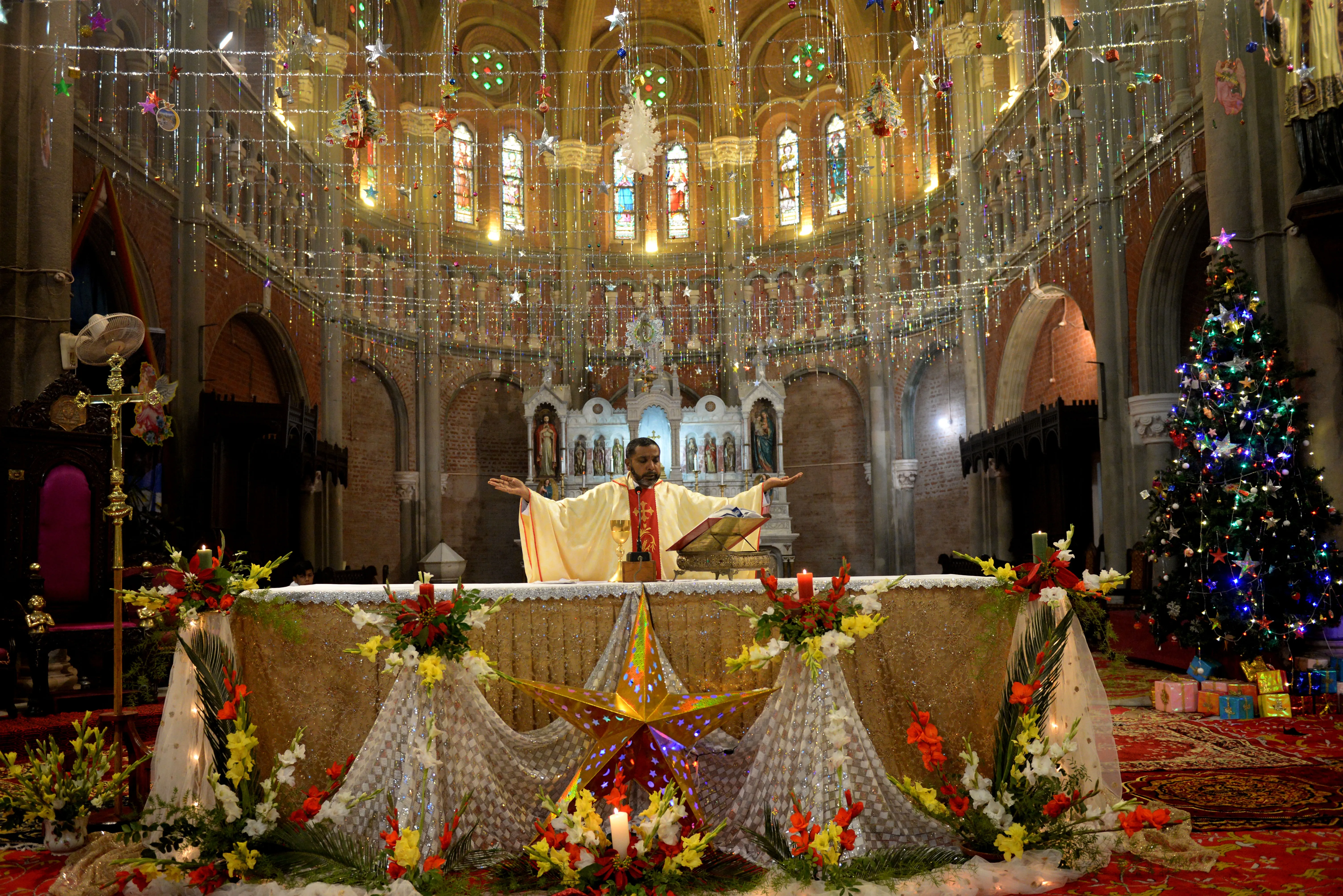 Christian devotees attend a prayer service at Sacred Heart Cathedral to celebrate Christmas in Lahore, Pakistan, on Dec. 25, 2021.?w=200&h=150