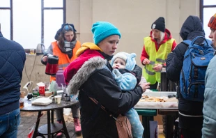 Refugees wait for trains at Lviv railway station in western Ukraine. Ruslan Lytvyn/Shutterstock.