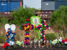 Texans brought prayer candles, bottles of water, and religious icons to a makeshift memorial at the site where 46 migrants were declared dead in San Antonio, Texas, in June 2022.