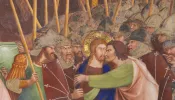Judas betrays Jesus with a kiss, 14th-century fresco in the Collegiata of San Gimignano, Italy.