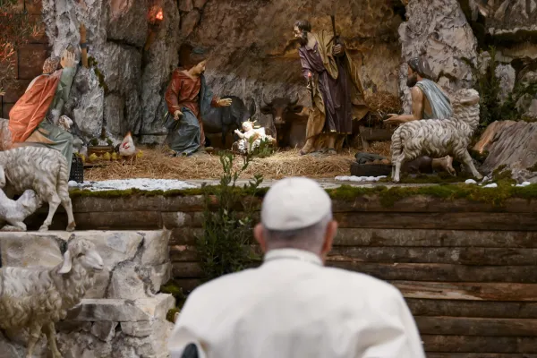 Pope Francis prays in front of the Nativity scene in St. Peter's Basilica on Dec. 24, 2023. Credit: Vatican Media