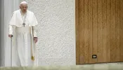 Pope Francis uses a cane to walk at his general audience on Nov. 29, 2023.