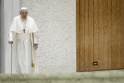 Pope Francis uses a cane to walk at his general audience on Nov. 29, 2023.