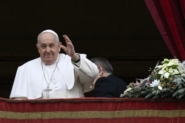 Pope Francis waves after he delivered his annual “urbi et orbi” address on Christmas from the central balcony of St. Peter’s Basilica on Dec. 25, 2023. Credit: Vatican Media