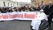 Pope Francis greets the faithful from his wheelchair during his Feb. 28, 2024 general audience at the Vatican.