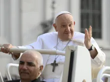 Pope Francis waves to pilgrims in St. Peter's Square at the Vatican at his general audience on Sept. 13, 2023.