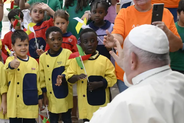 Pope Francis talks with children during a meeting with charity workers at the Centro Paroquial de Serafina in Lisbon on Aug. 4, 2023. Vatican Media