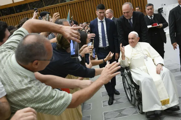 Pope Francis greets participants in his weekly public audience in the Vatican's Paul VI Hall on Aug. 30, 2023. Vatican Media