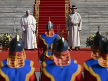 Pope Francis stands beside Mongolian President Ukhnaagiin Khürelsükh in Sukhbaatar Square in front of the State Palace in Ulaanbaatar on Sept. 2, 2023.