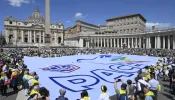 Members of ACLI (Italian Christian Workers' Associations) hold a sign with the word "peace" in Italian, in St. Peter's Square on June 1, 2024.