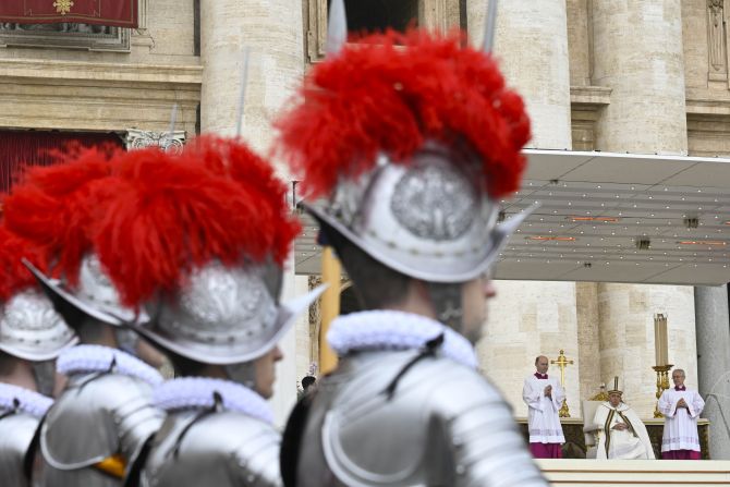 Swiss Guards stand at attention as during Easter Sunday Mass in St. Peter's Square on March 31, 2024.