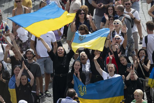 Ukrainian Catholics wave to the pope during his Sunday Angelus address on Sept. 17, 2023. Credit: Vatican Media