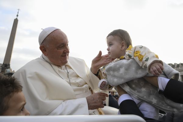 Pope Francis blesses a toddler at his Wednesday general audience on Nov. 15, 2023. Credit: Vatican Media