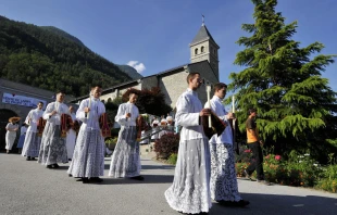 Priests and deacons of the Society of St. Pius X walk to Mass in Econe, western Switzerland, on June 29, 2009. Credit: FABRICE COFFRINI/AFP via Getty Images