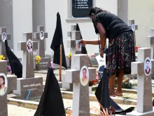 A woman was seen paying tribute to victims of the 2019 Easter Sunday terror attacks at a cemetery in Negombo, Sri Lanka.