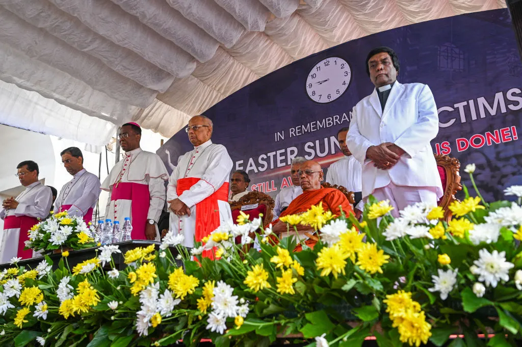 The Vatican ambassador to Colombo, Archbishop Brian Udaigwe (third from left) and Sri Lanka's Cardinal Malcolm Ranjith (fourth from left) take part in a remembrance service during the fifth anniversary of the Easter Sunday suicide attacks at St. Anthony Church in Colombo on April 21, 2024.?w=200&h=150