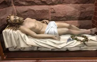 The Christ in Death statue after restoration on display at the Cathedral of St. Mary in Fargo, North Dakota. Credit: New Earth/submitted photo