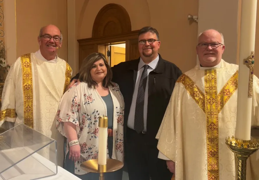 Recent convert Steve Dow and his wife, Amanda, pose for a photo with Deacon M.J. Kersenbrock, left, and Father Bernard Starman after the Easter Vigil April 16, 2022 at St. Patrick Church in O’Neill, Nebraska.?w=200&h=150