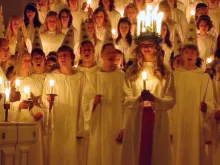 Children participate in the annual St. Lucy's Day celebration in Sweden.